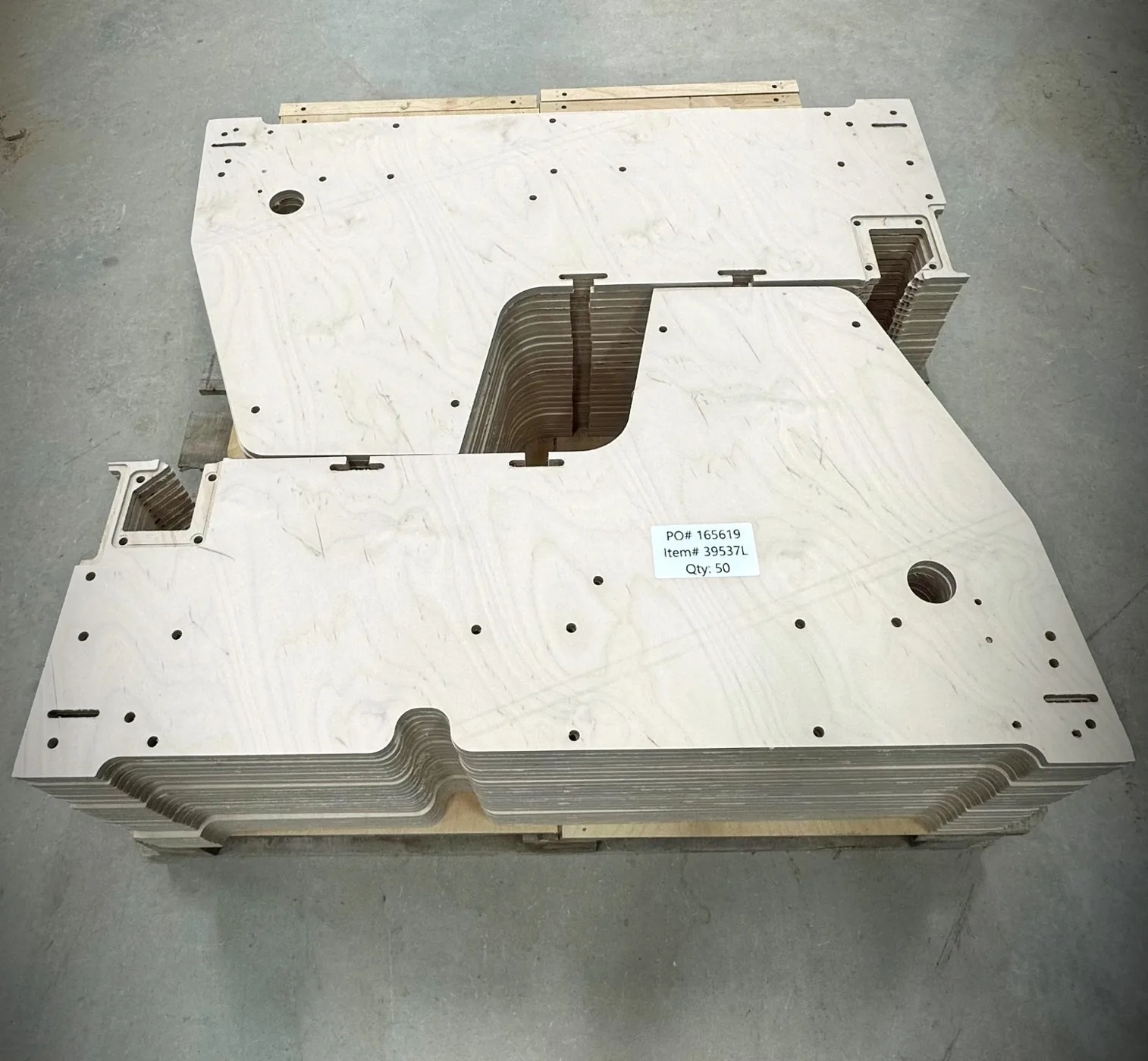 CNC plywood parts — Custom-cut plywood panels with machined openings and holes.